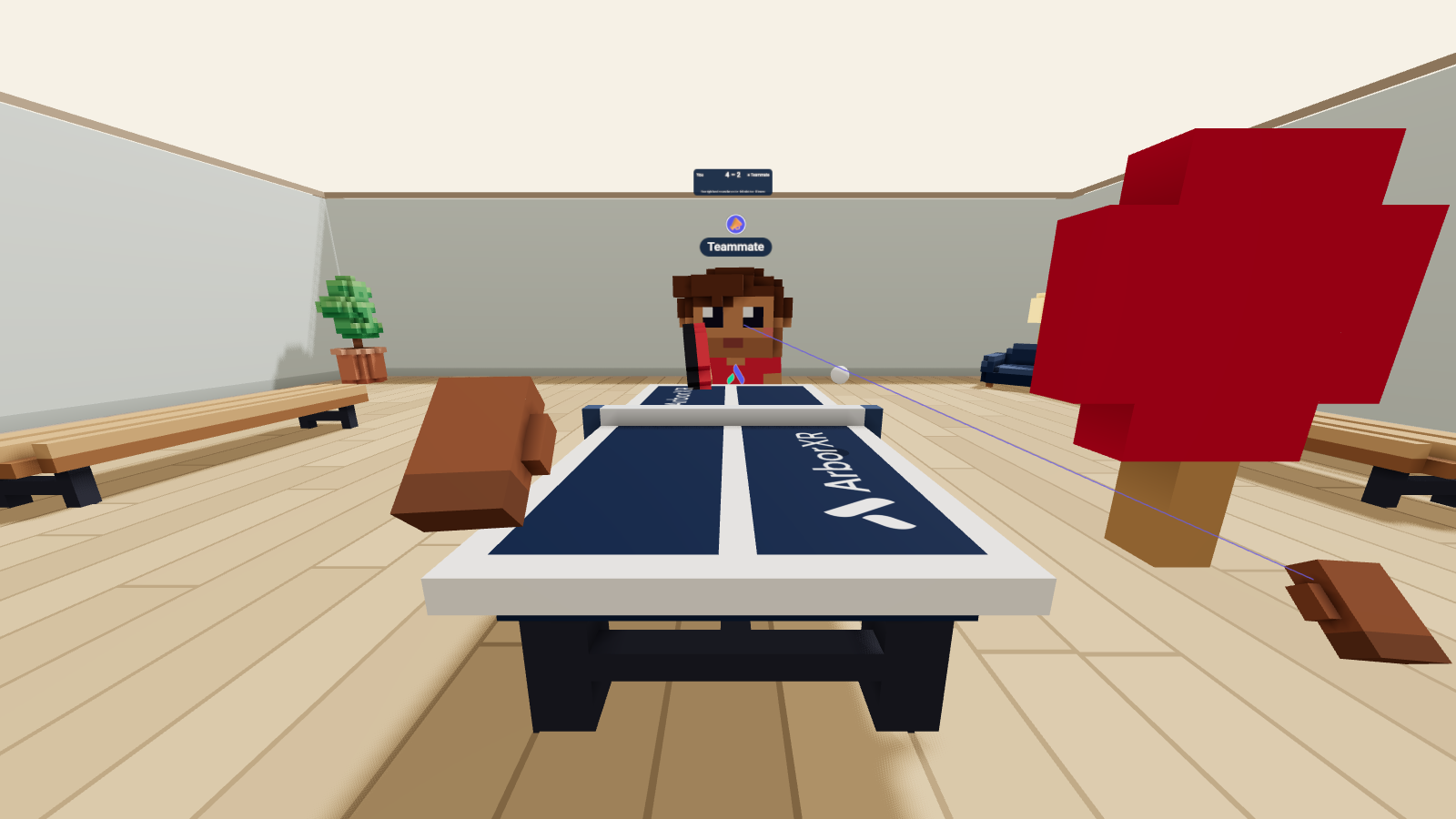 Ping pong in VR. A teammate on a desktop returns the ball, the score floats over the net, and my paddle follows my right hand